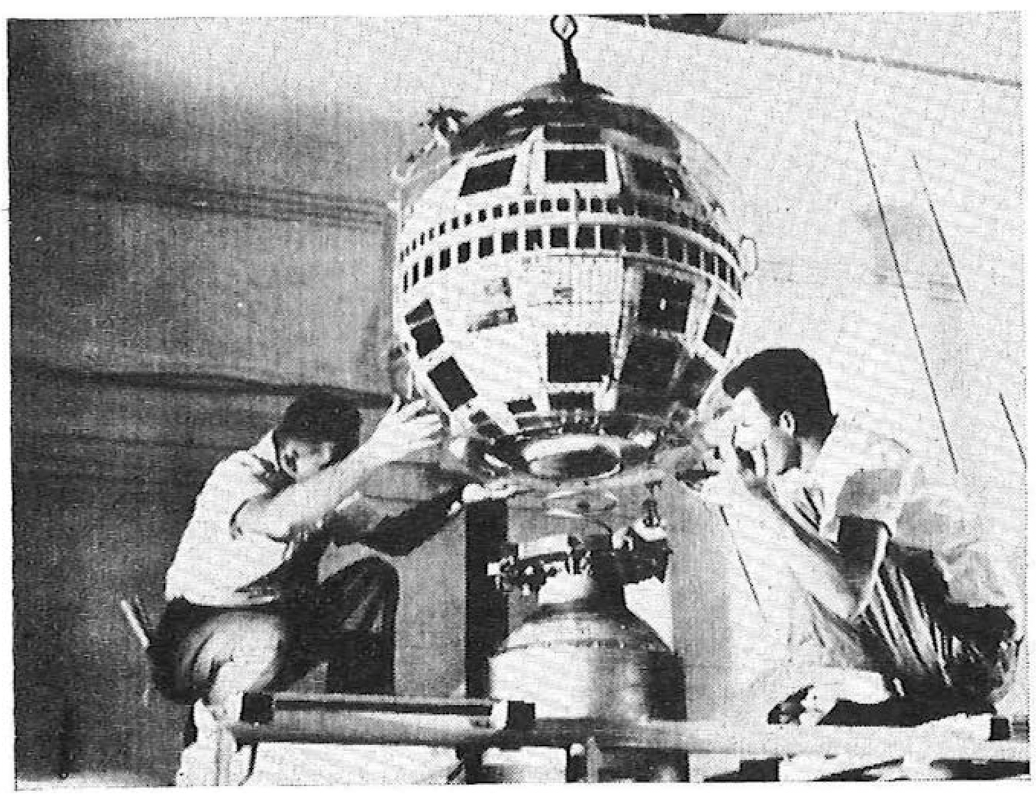The TELSTAR satellite being mounted on the Thor-Delta launch vehicle