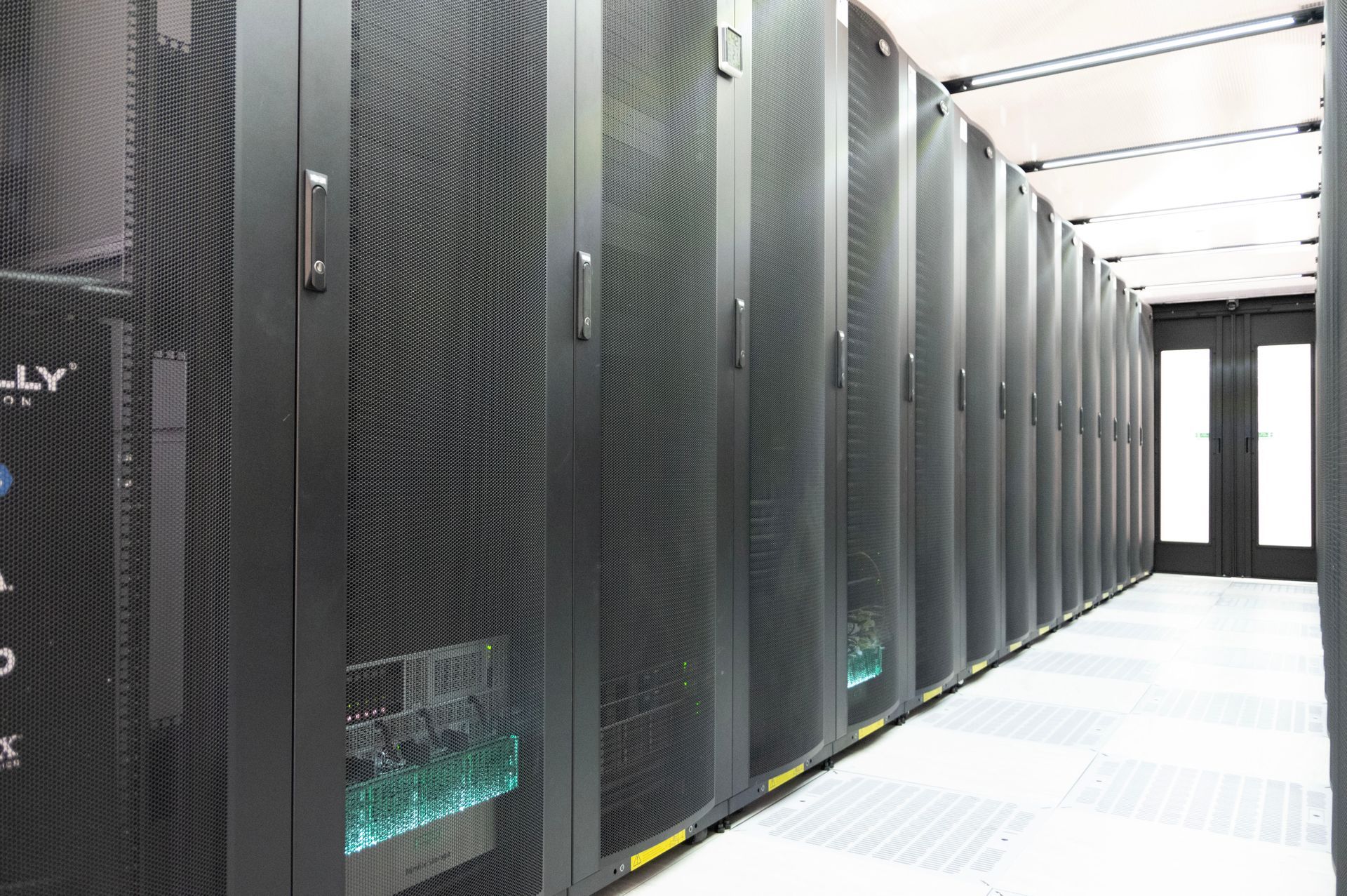 Black metal racks of equipment are seen in Goonhilly’s state-of-the-art data centre in Cornwall UK