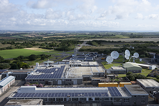 An aerial view shows Goonhilly's extensive range of antennas, and it's buildings with solar panels on the roof