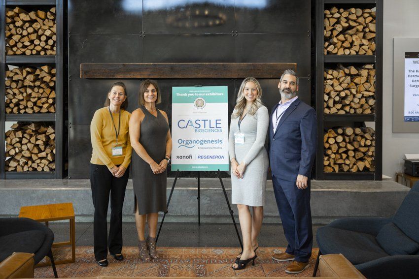 A group of people are standing in front of a sign that says castle.