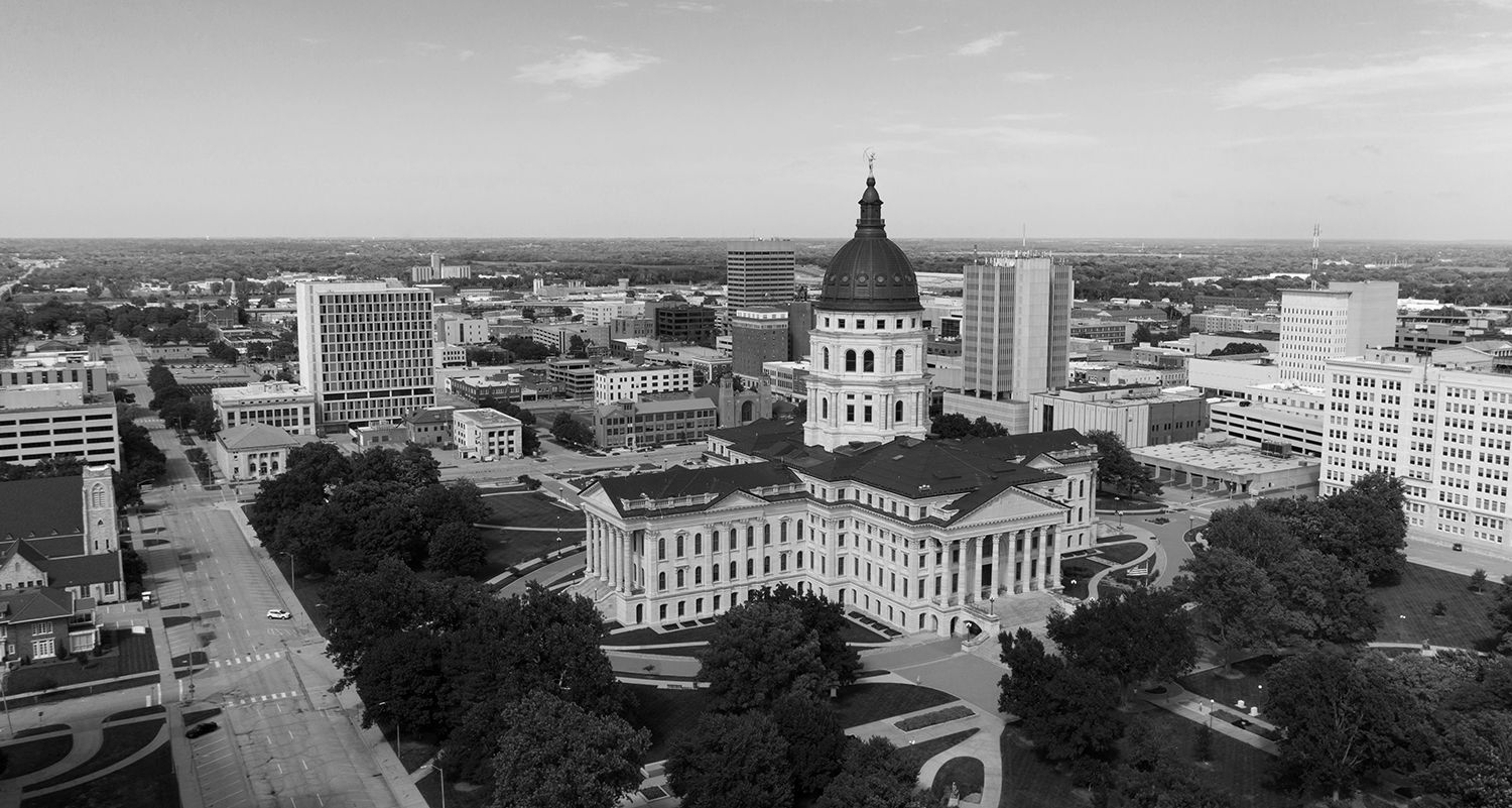 An aerial view of the capitol building in texas in a black and white photo.