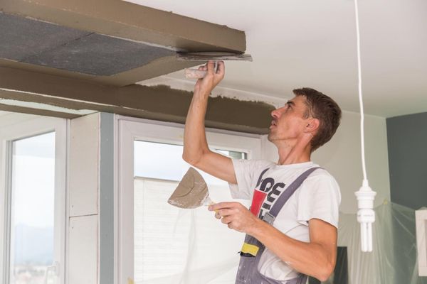 worker painting the ceiling