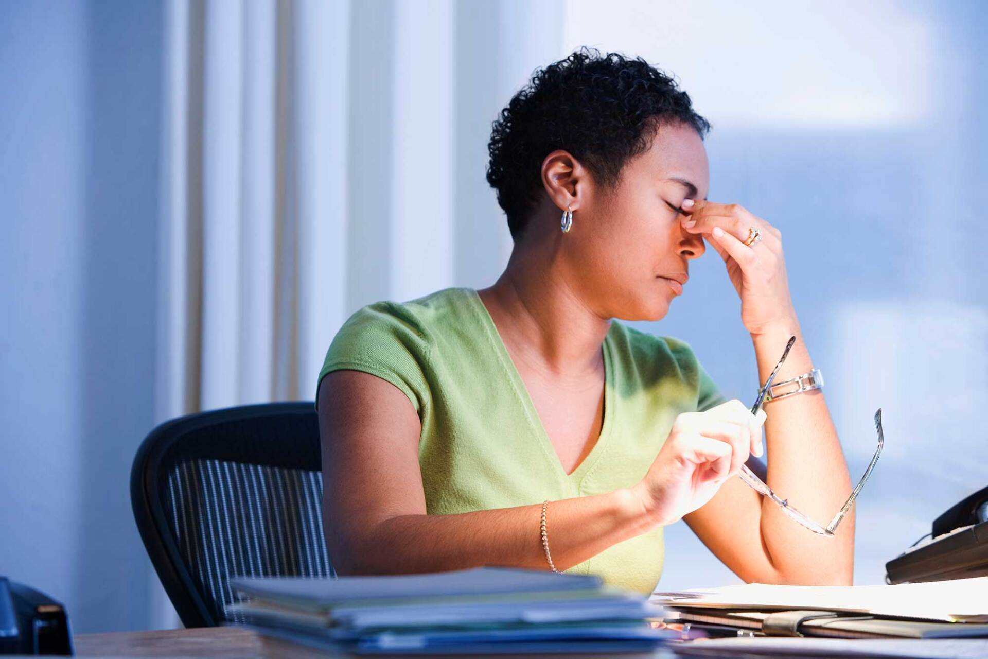 Stressed Woman — Portage, MI — Cornerstone Chiropractic Center