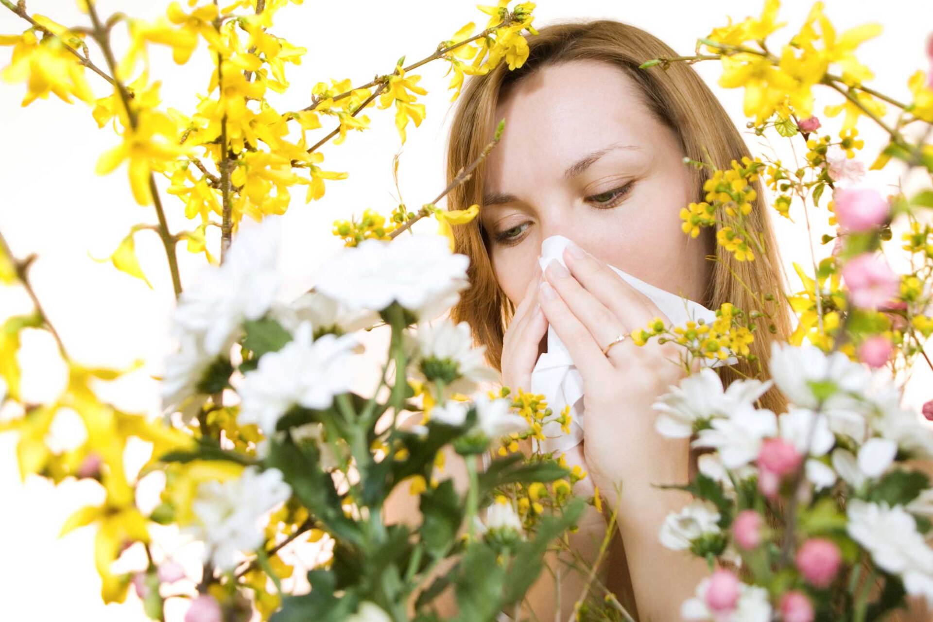 Young Woman Sneezing — Portage, MI — Cornerstone Chiropractic Center