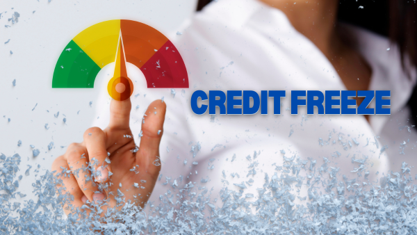 A woman is pressing a button that says credit freeze