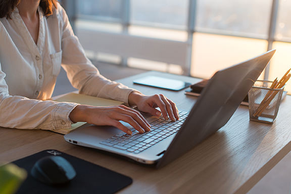 Person using laptop to review donor privacy policy
