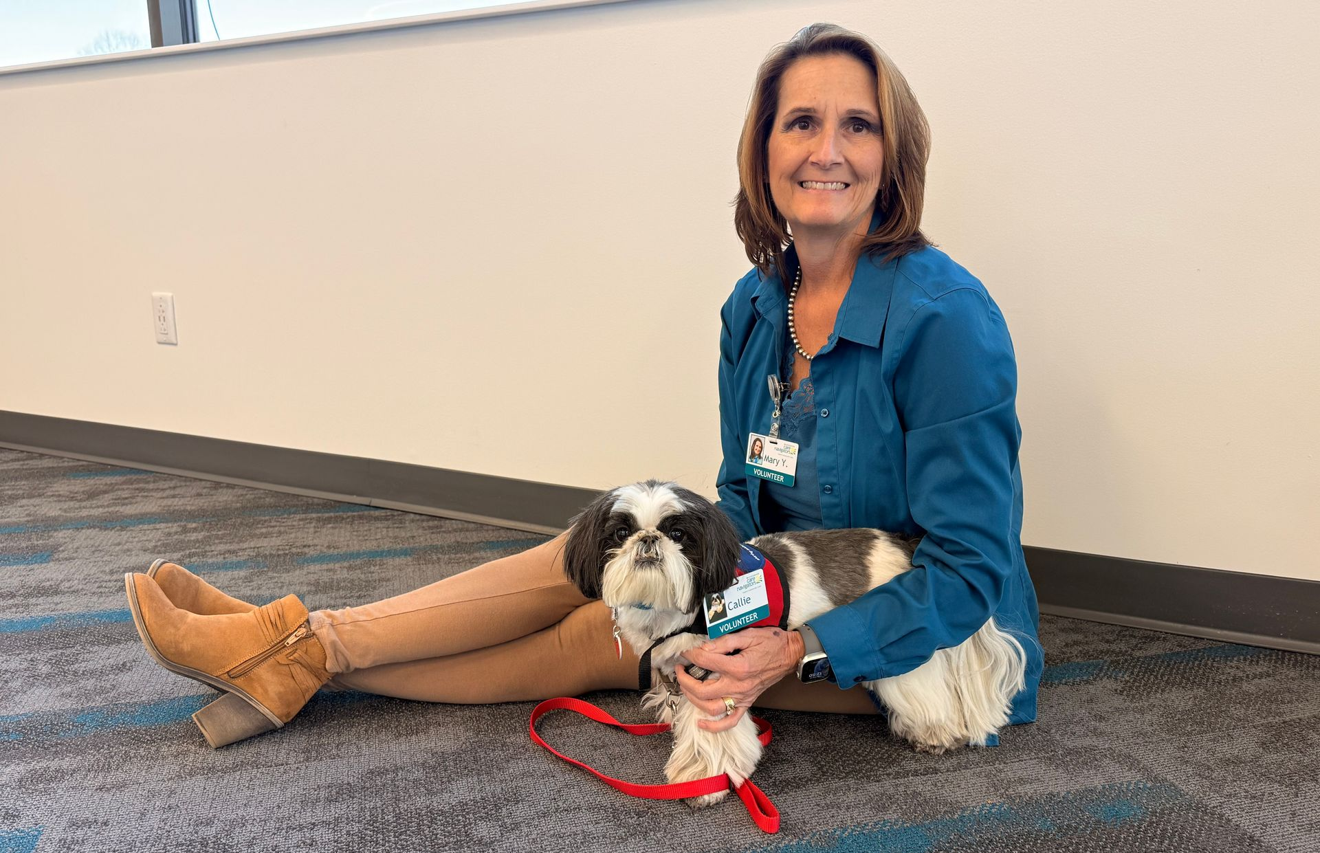 Mary Yohon, Associate Director of Philanthropy and Volunteer, with her volunteer therapy dog, Callie