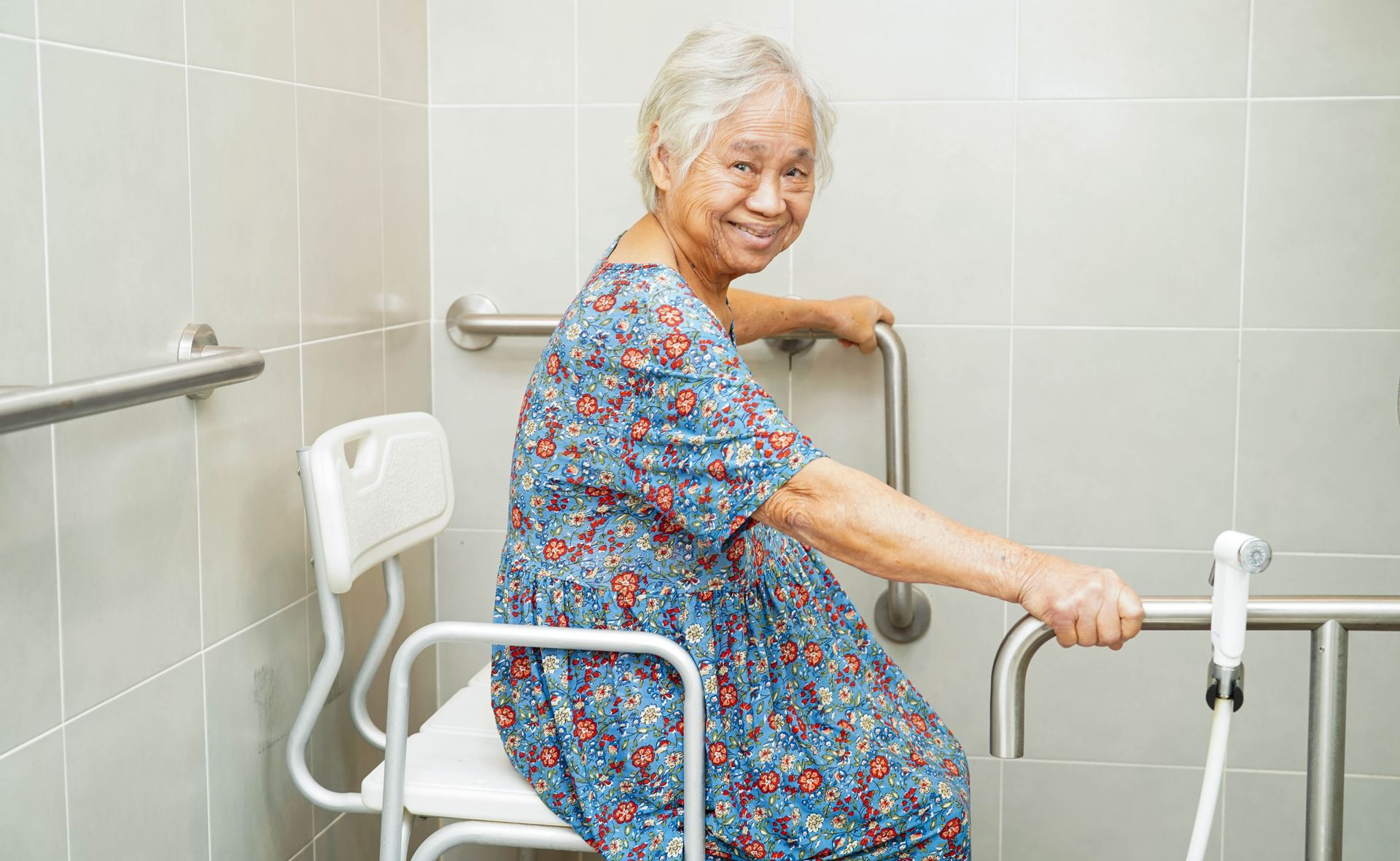 Elderly woman with modifications in bathroom