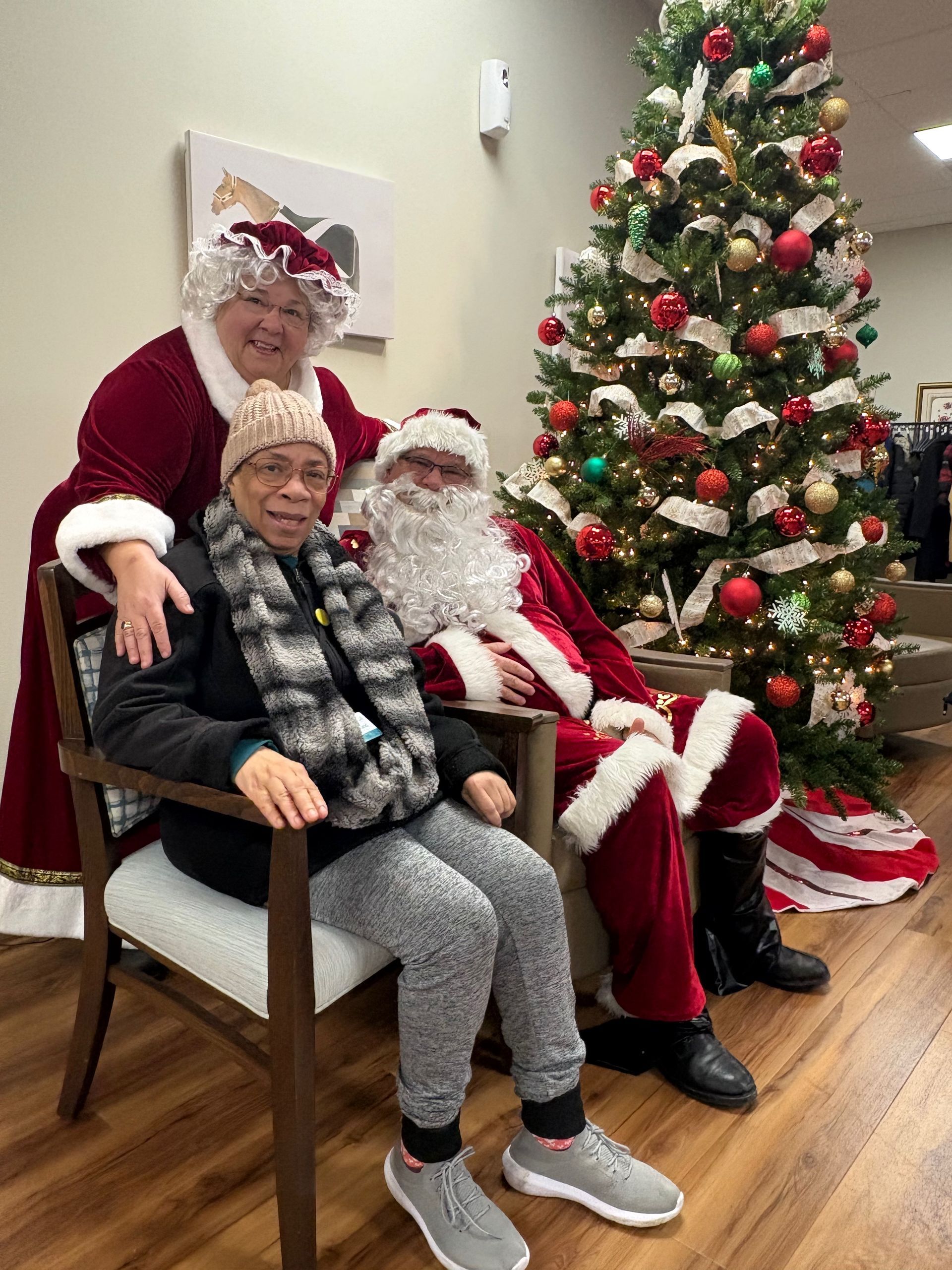 PACE participant with Santa and Mrs. Claus