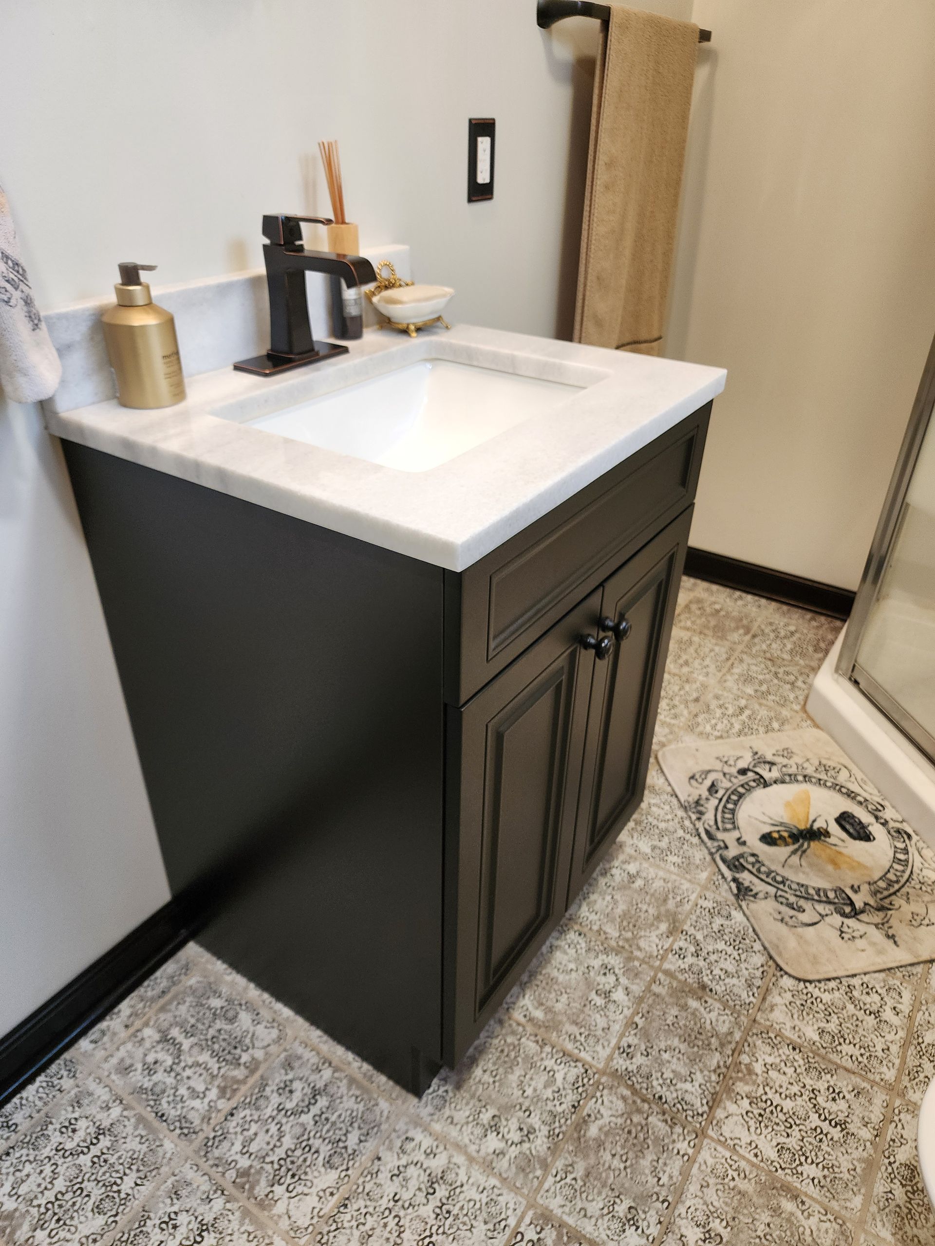 Man in safety gear smoothing plaster on a wall with a yellow trowel. Man in safety gear smoothing plaster on a wall with a yellow trowel.