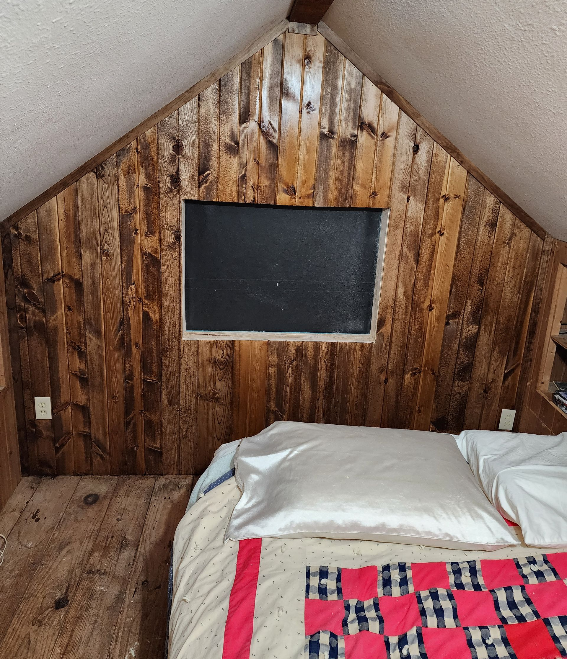 Plumber kneels under a kitchen sink, measuring pipes with a tape measure. A toolbox and tools lie nearby. Plumber kneels under a kitchen sink, measuring pipes with a tape measure. A toolbox and tools lie nearby.