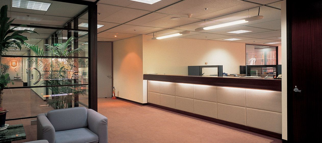 A waiting room with a chair and a counter