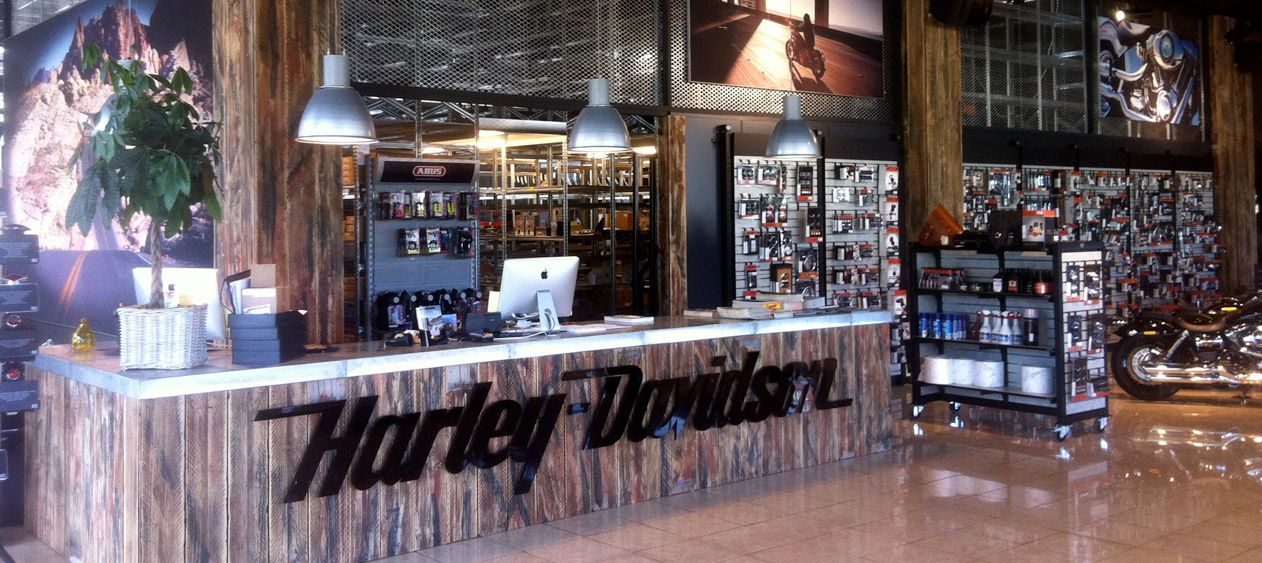 A harley davidson store with a wooden counter