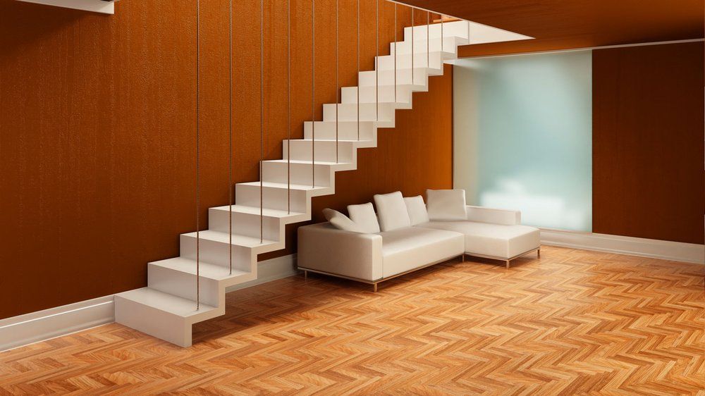 A living room with a staircase and a couch