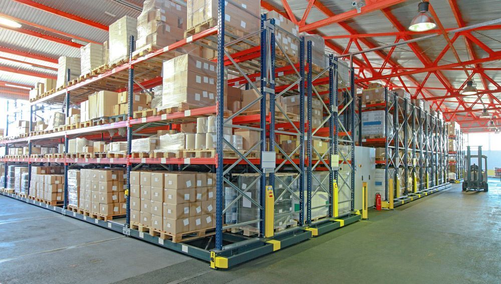 A large warehouse filled with lots of boxes and shelves.