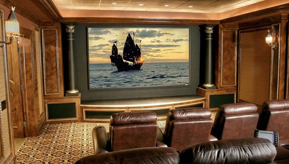 A home theater with a pirate ship on the screen