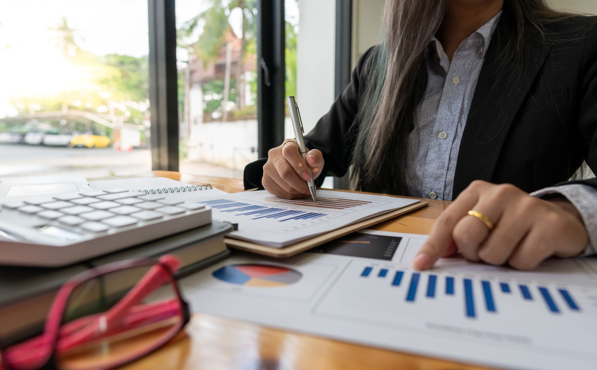 An accountant performing bookkeeping services, making a financial report.