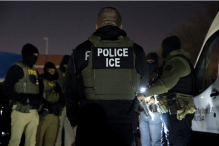 A man wearing a vest that says police ice