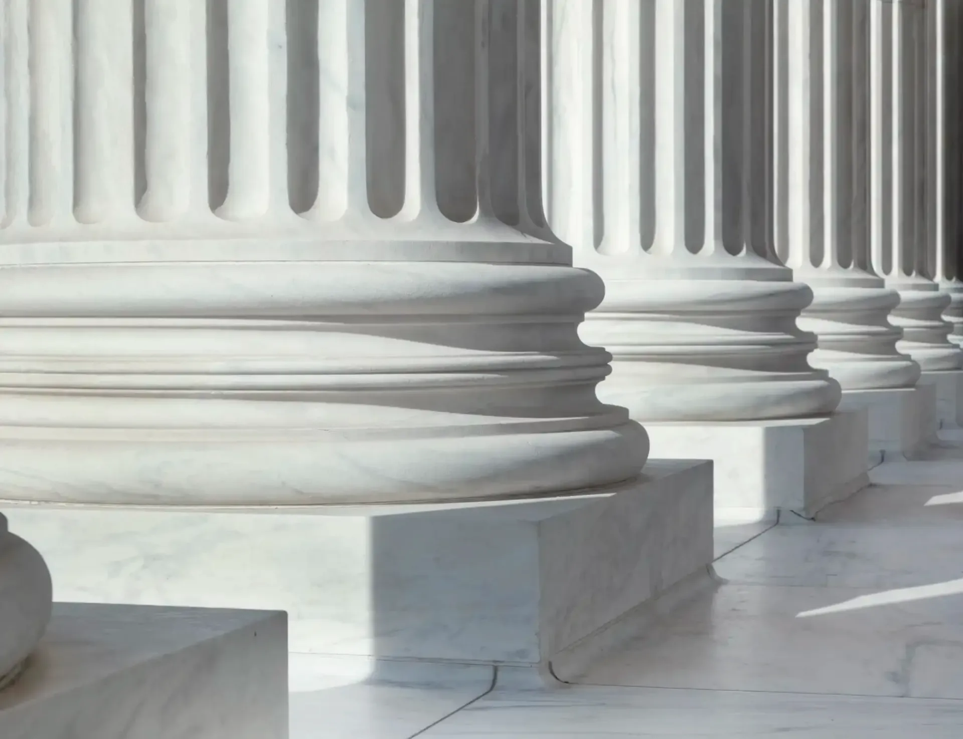 A row of white columns are lined up in a row