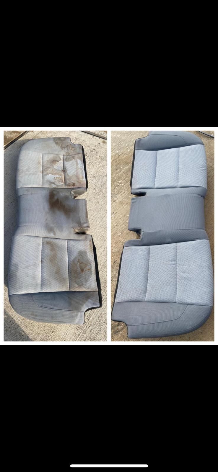 The interior of a car with red seats and a steering wheel