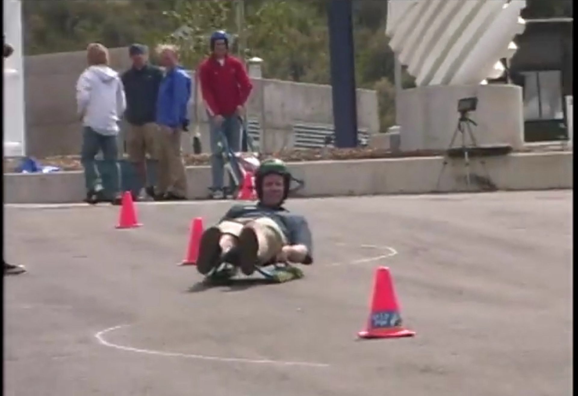 Tom Wright in a helmet is rolling down a road