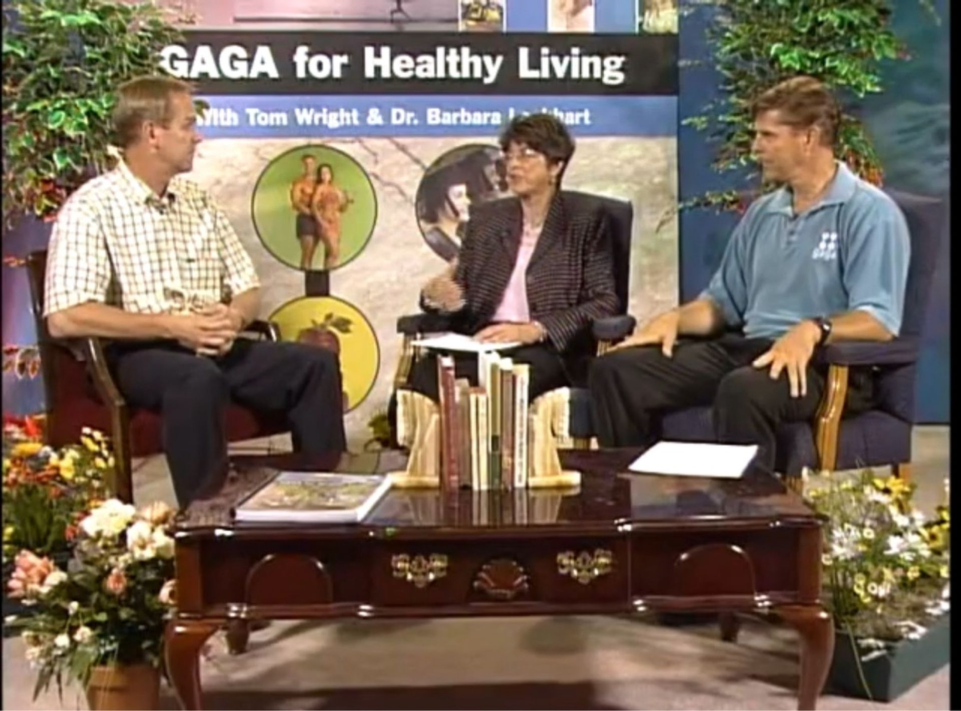 Three people are sitting in front of a sign that says gaga for healthy living
