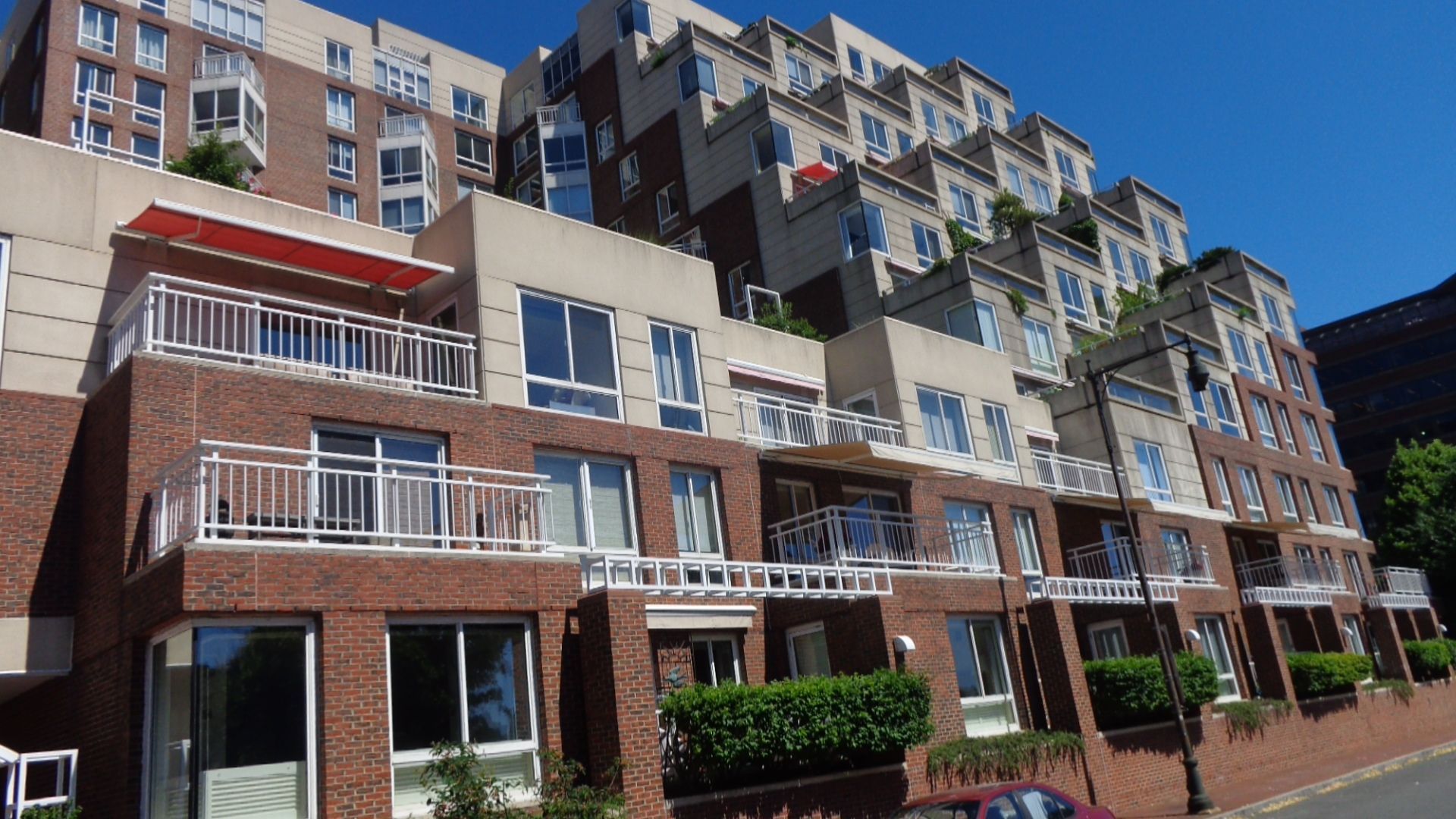 A large apartment building with a lot of windows and balconies