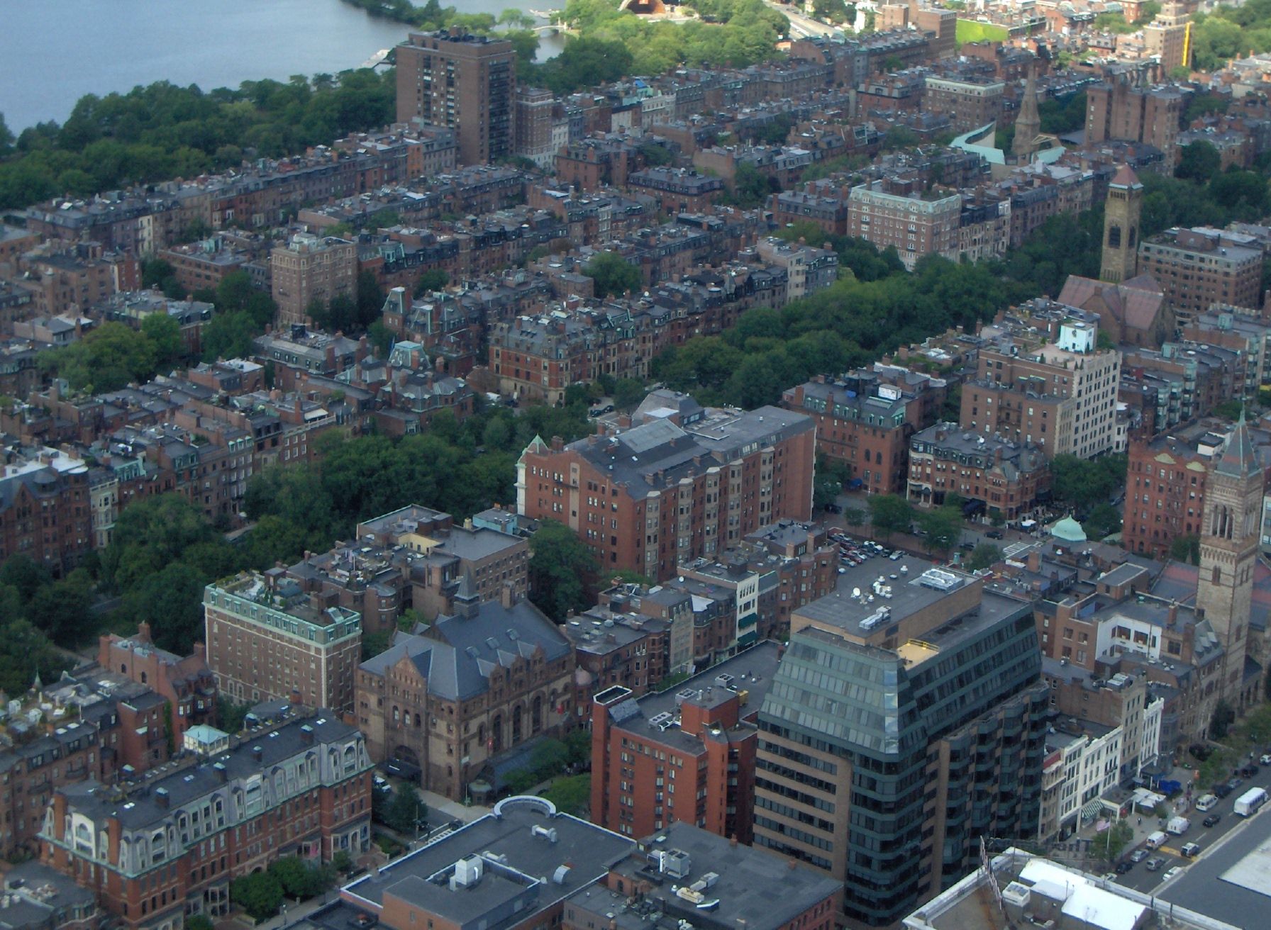 An aerial view of a city with lots of buildings and trees