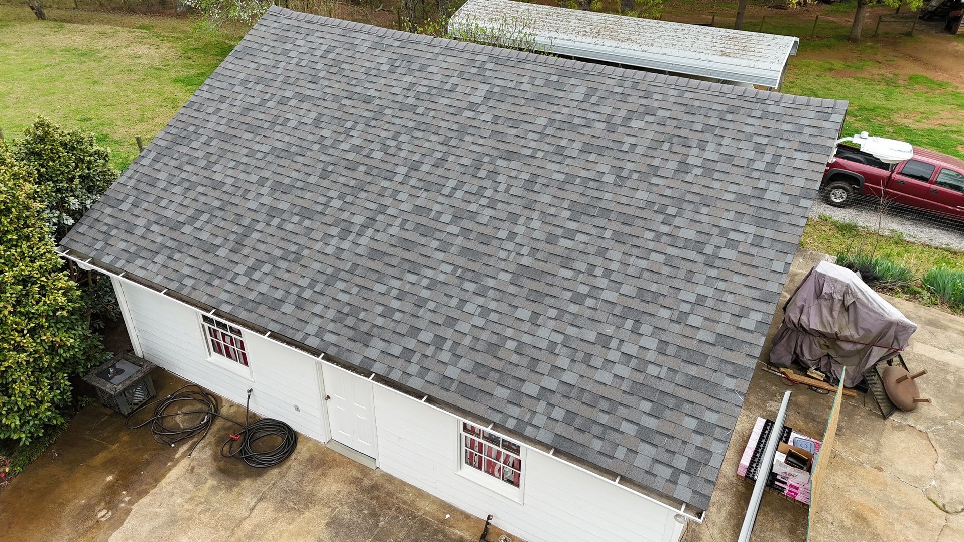 An aerial view of a barn with a new roof.
