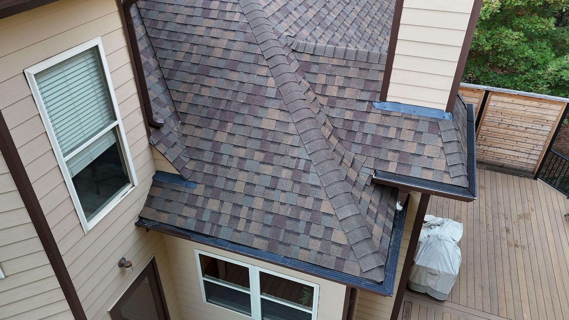 An aerial view of a house with a roof and windows.