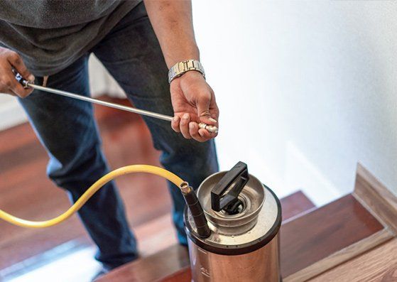 Worker Spraying Pesticides — Jonesboro, AR — NEA Termite & Pest Control