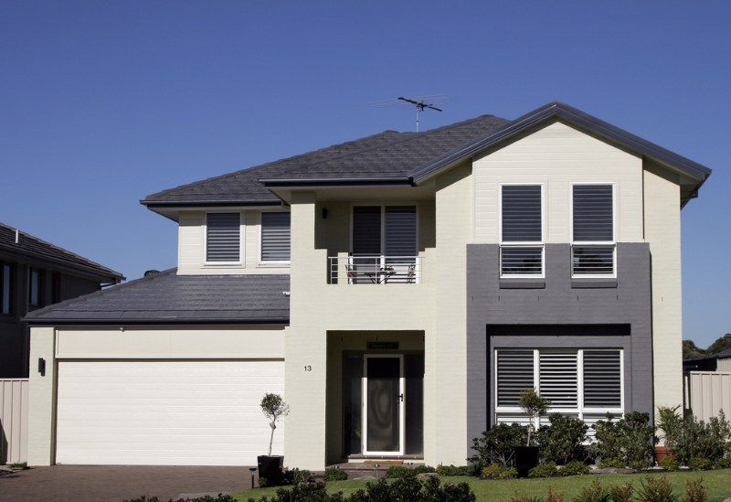Large House With a Blue Sky in the Background — Coffs Garage Doors & Motors in Toormina, NSW