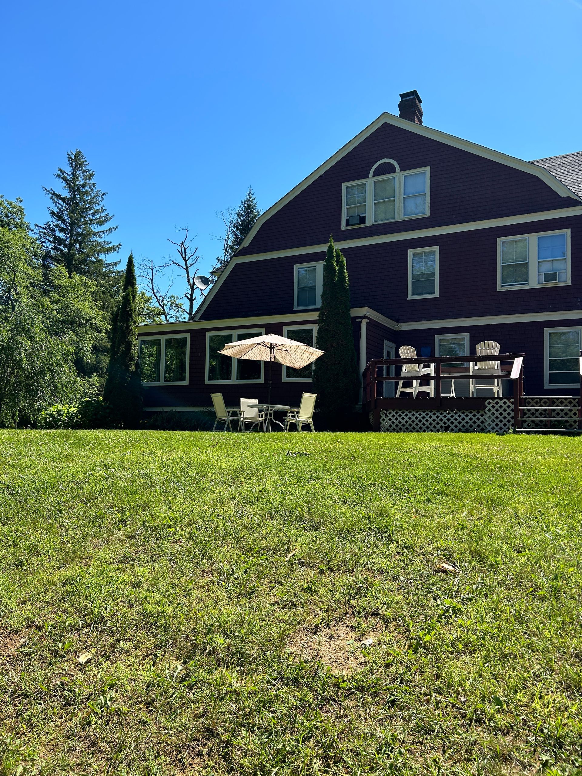 A large house with a large lawn in front of it