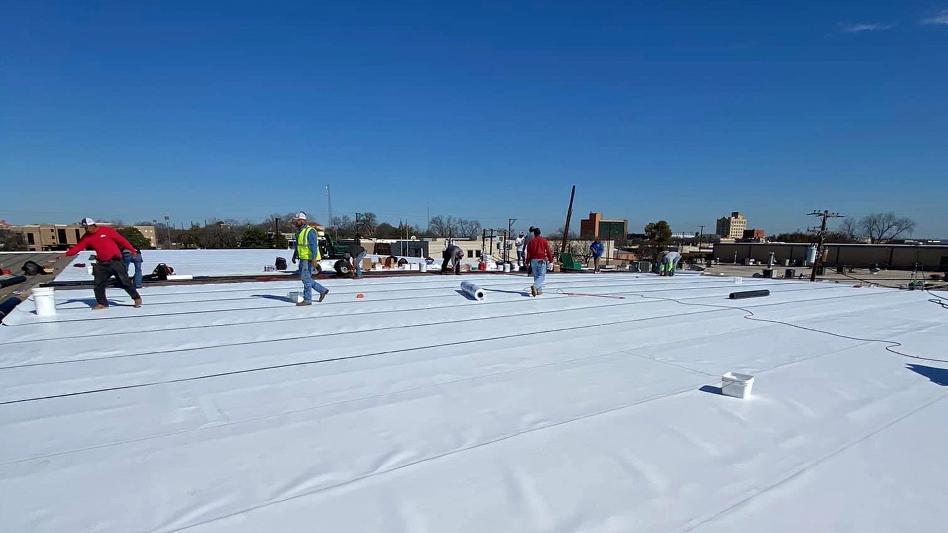 Men working on a commercial roof