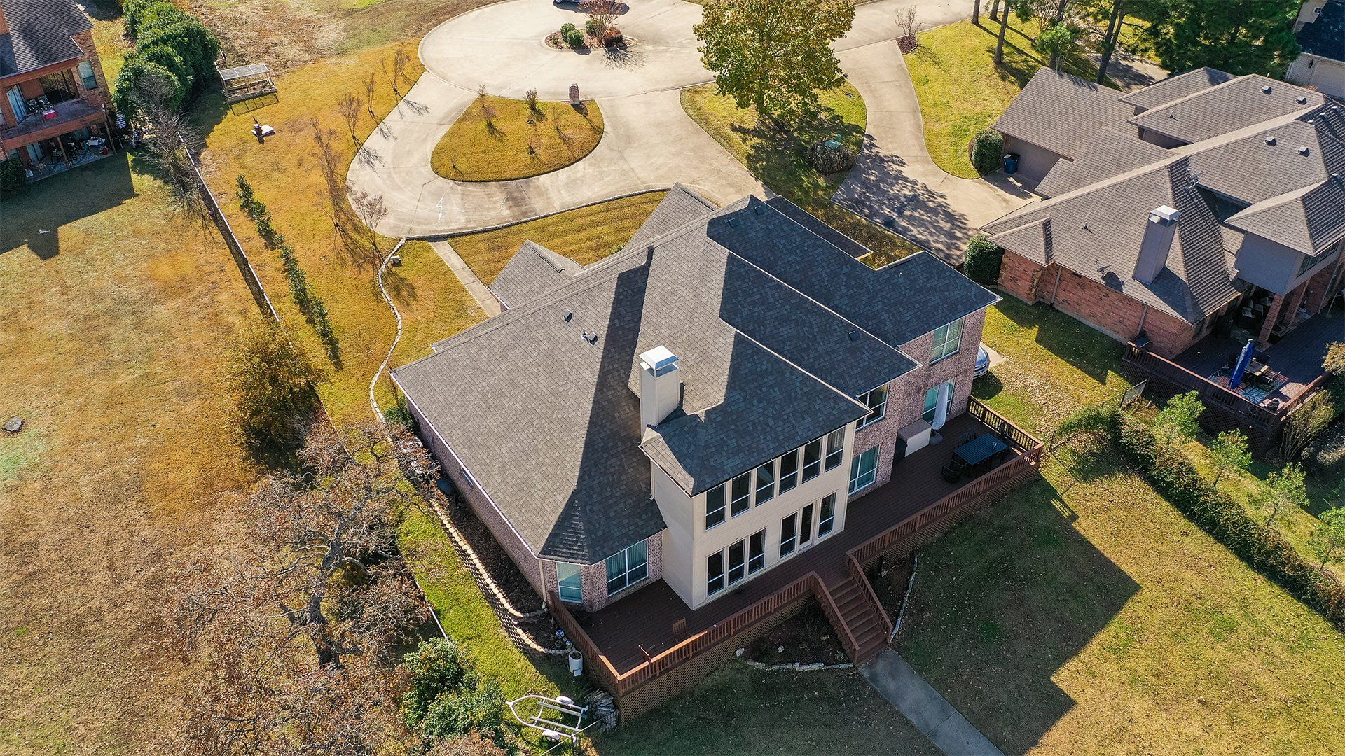Large residential house with a shingle roof