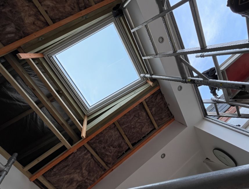 Looking up at a skylight in a building under construction