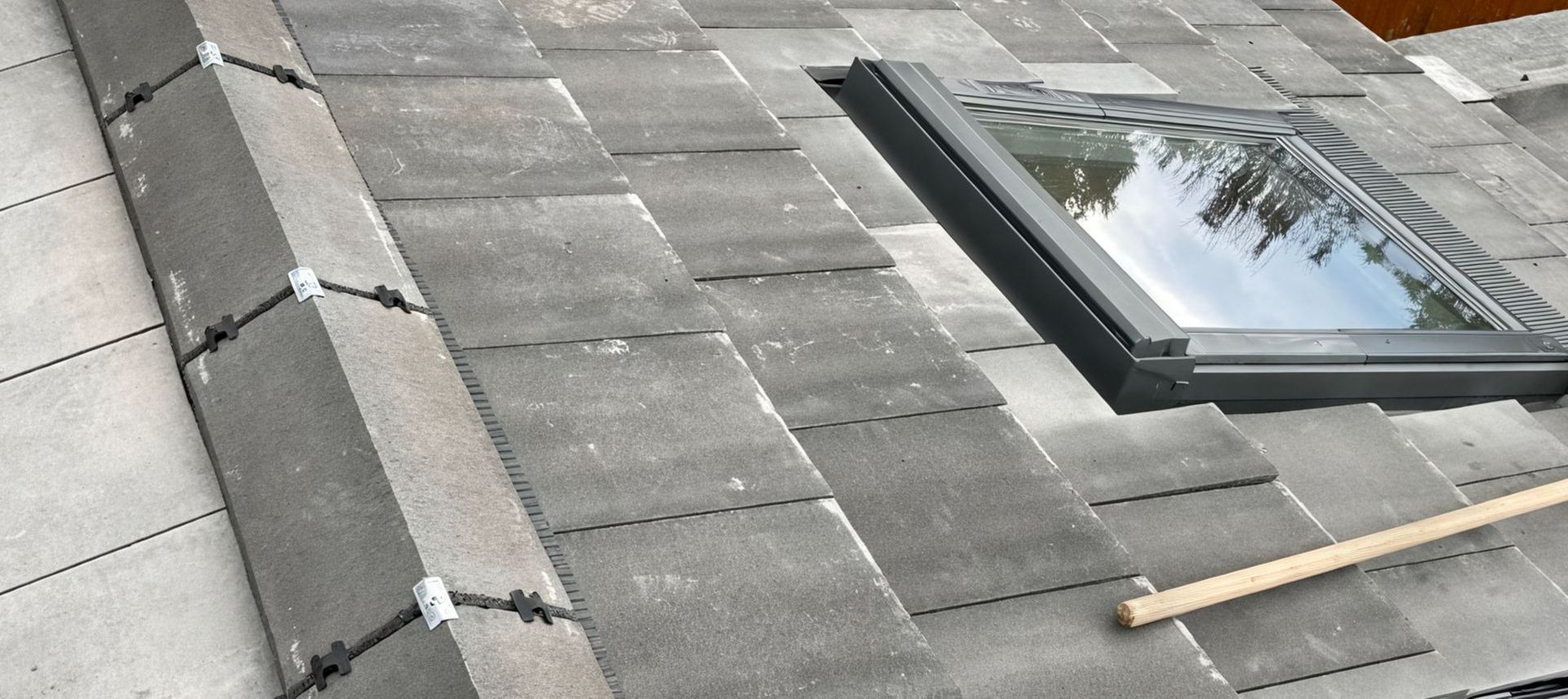 A roof with a skylight in the middle of it