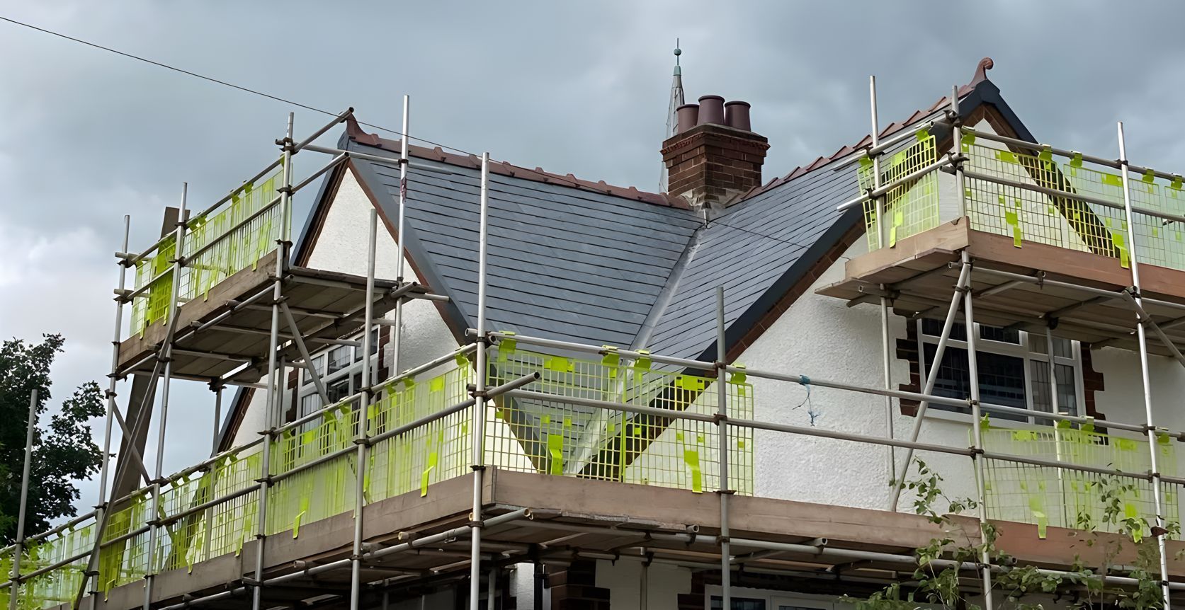 A house is being built with scaffolding around it.