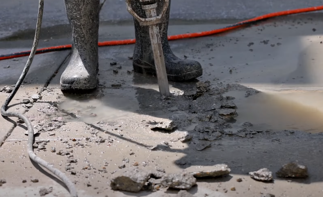 Empty concrete driveway being jackhammered in Montebello California while preparing the site for concrete replacement
