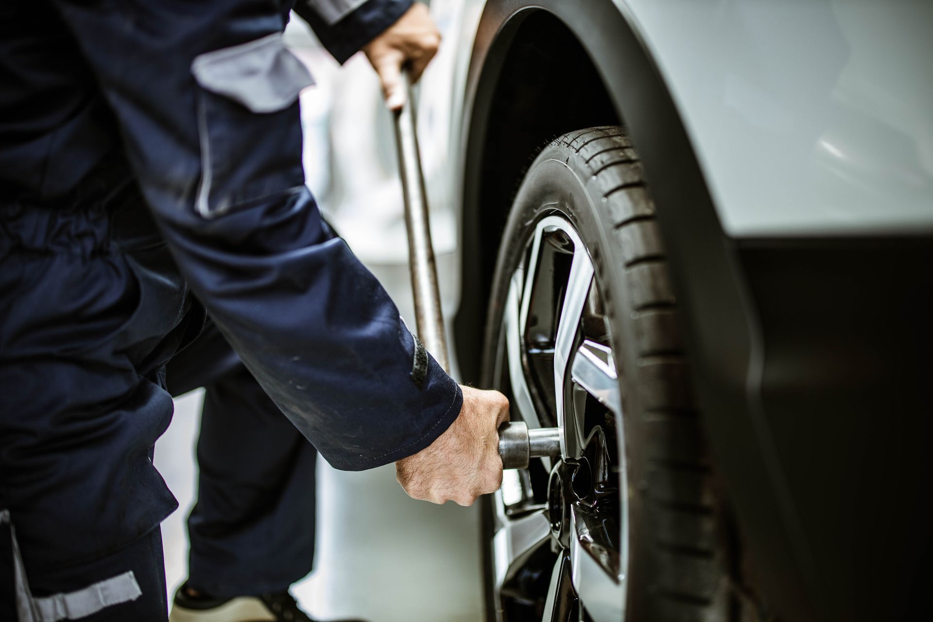 Mechanic replacing worn tires in an auto repair shop – Pike, MD – Lynn's Automotive