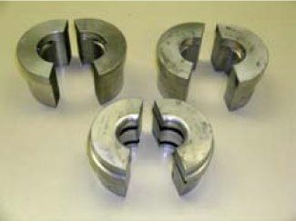 A group of metal pieces sitting on top of each other on a table.