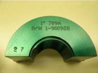 A green object with the number 27 on it is sitting on a table.