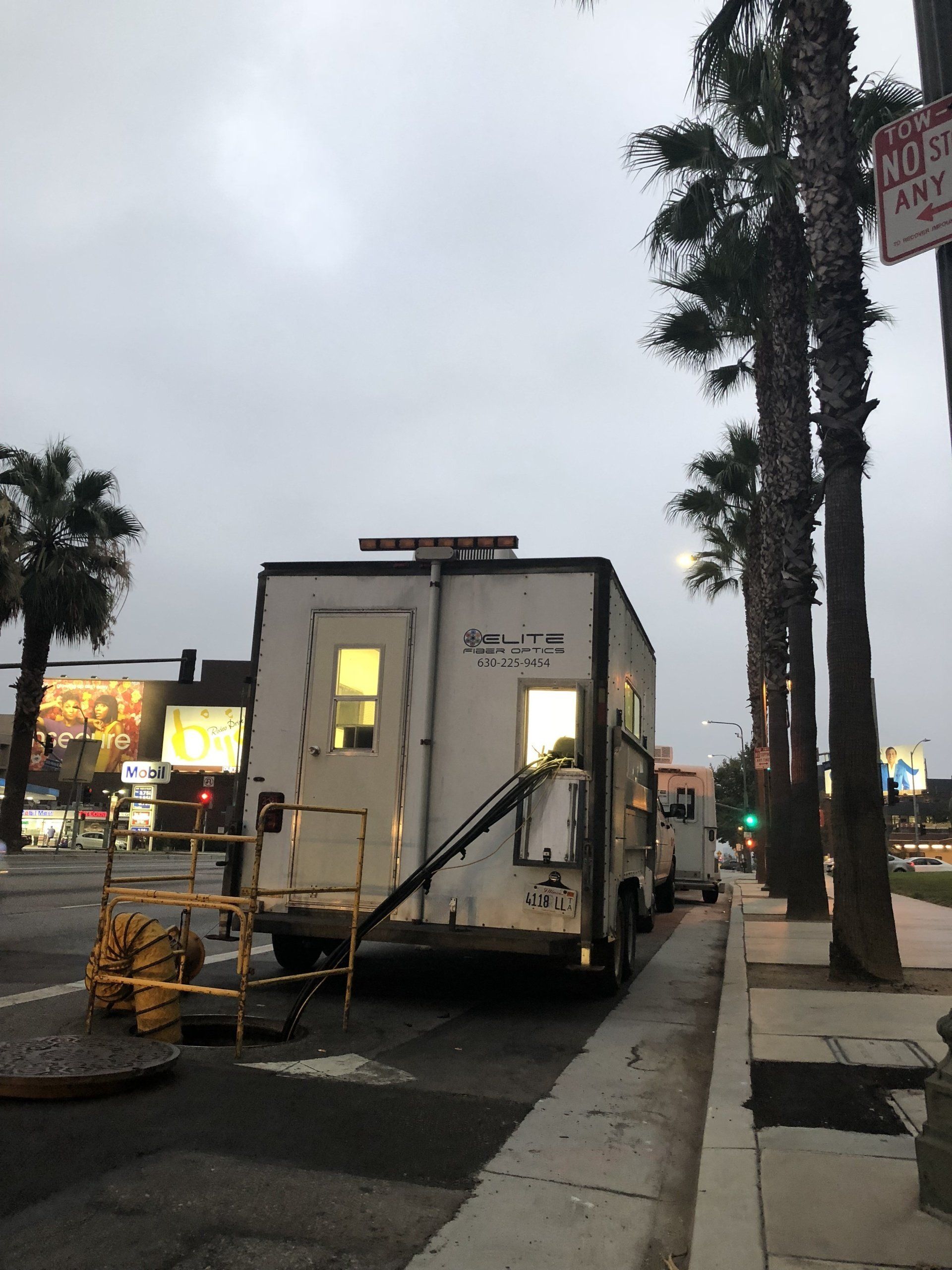 A white truck is parked on the side of the road
