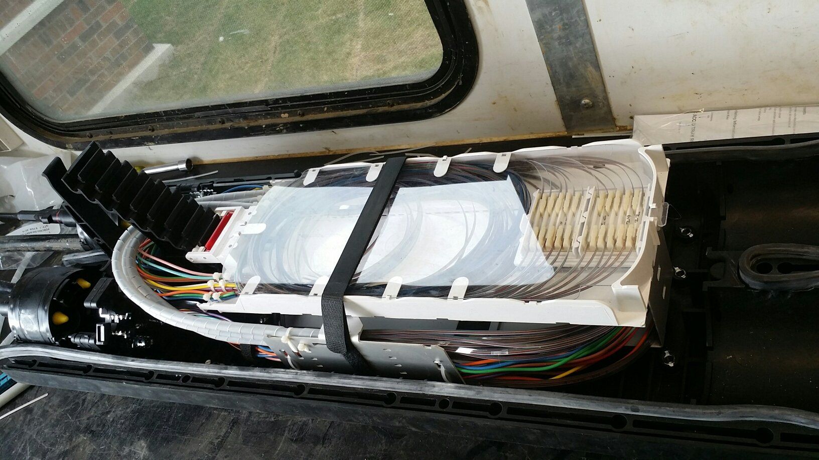 A bunch of wires are coming out of a car