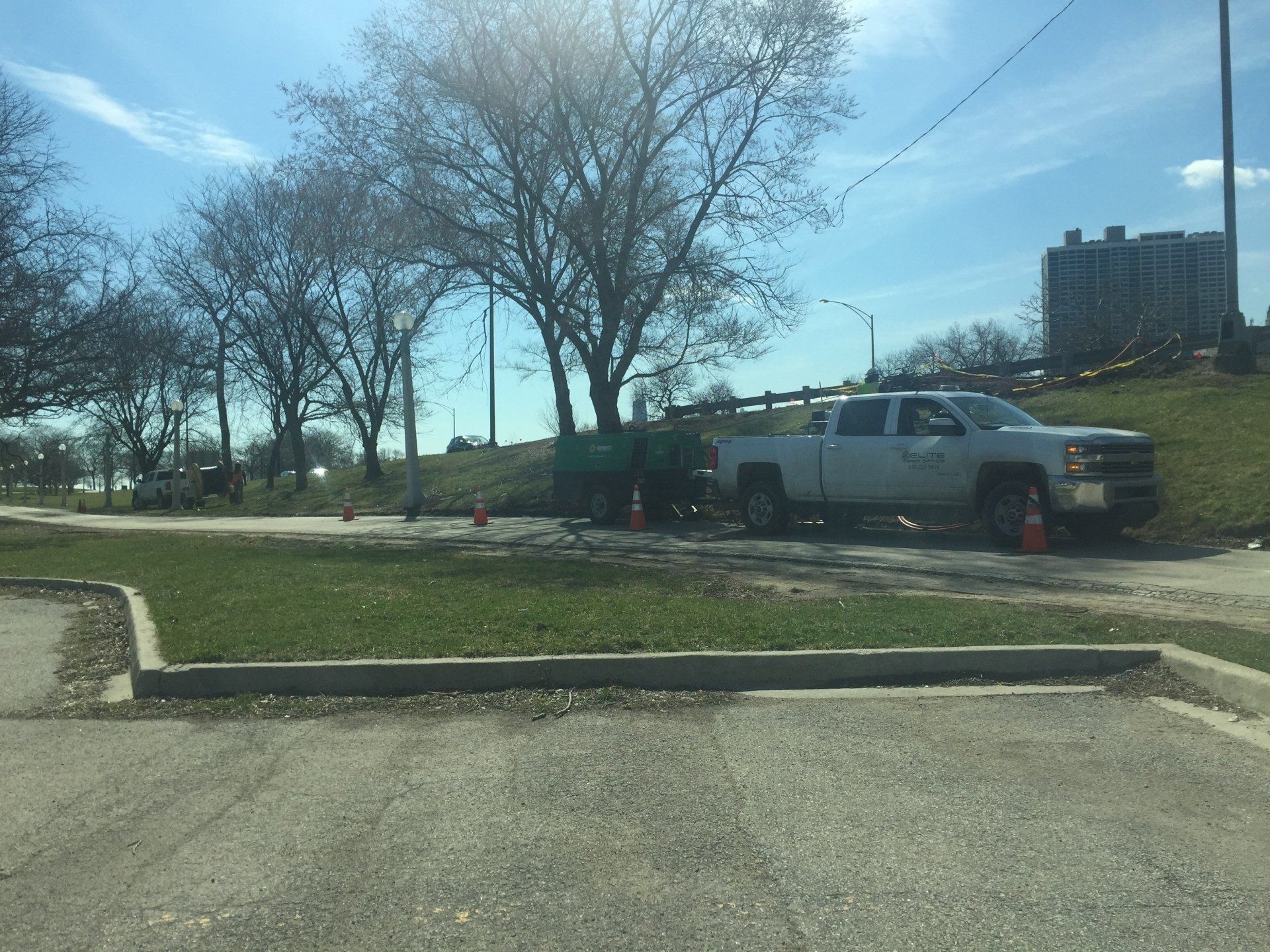 A white truck is parked in a parking lot