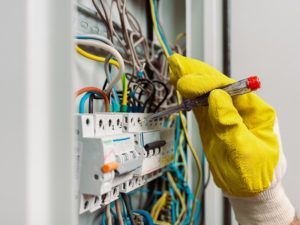 electrician working on a panel