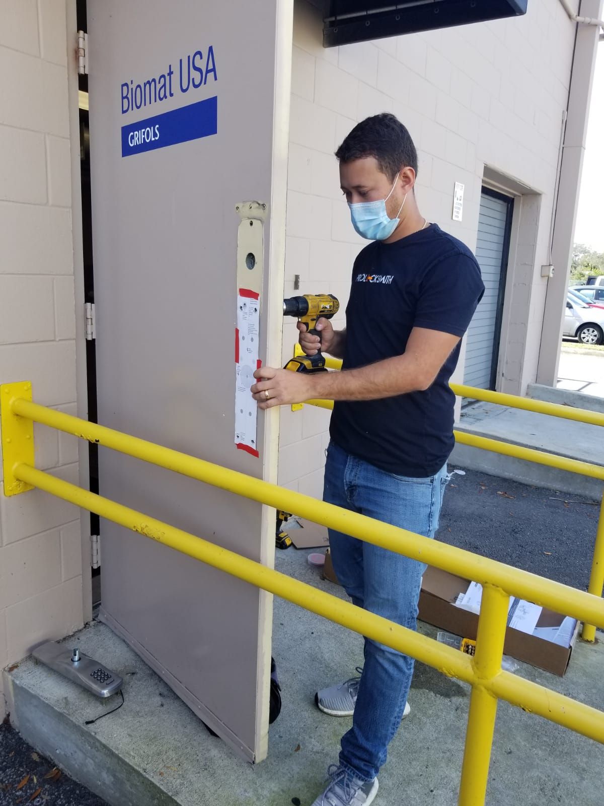 technician working on installing lock