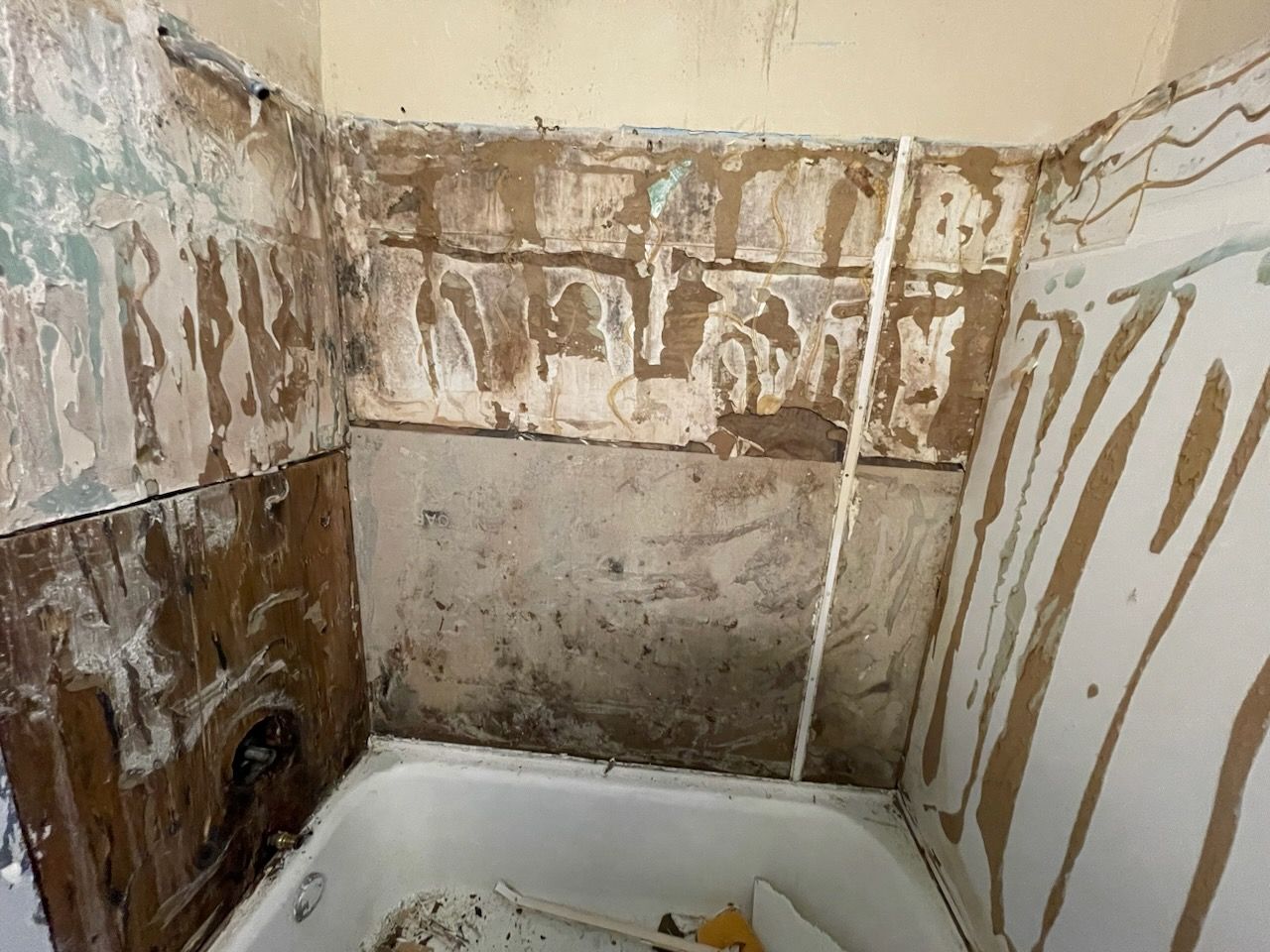 A bathroom is being remodeled with a bathtub , sink and toilet .