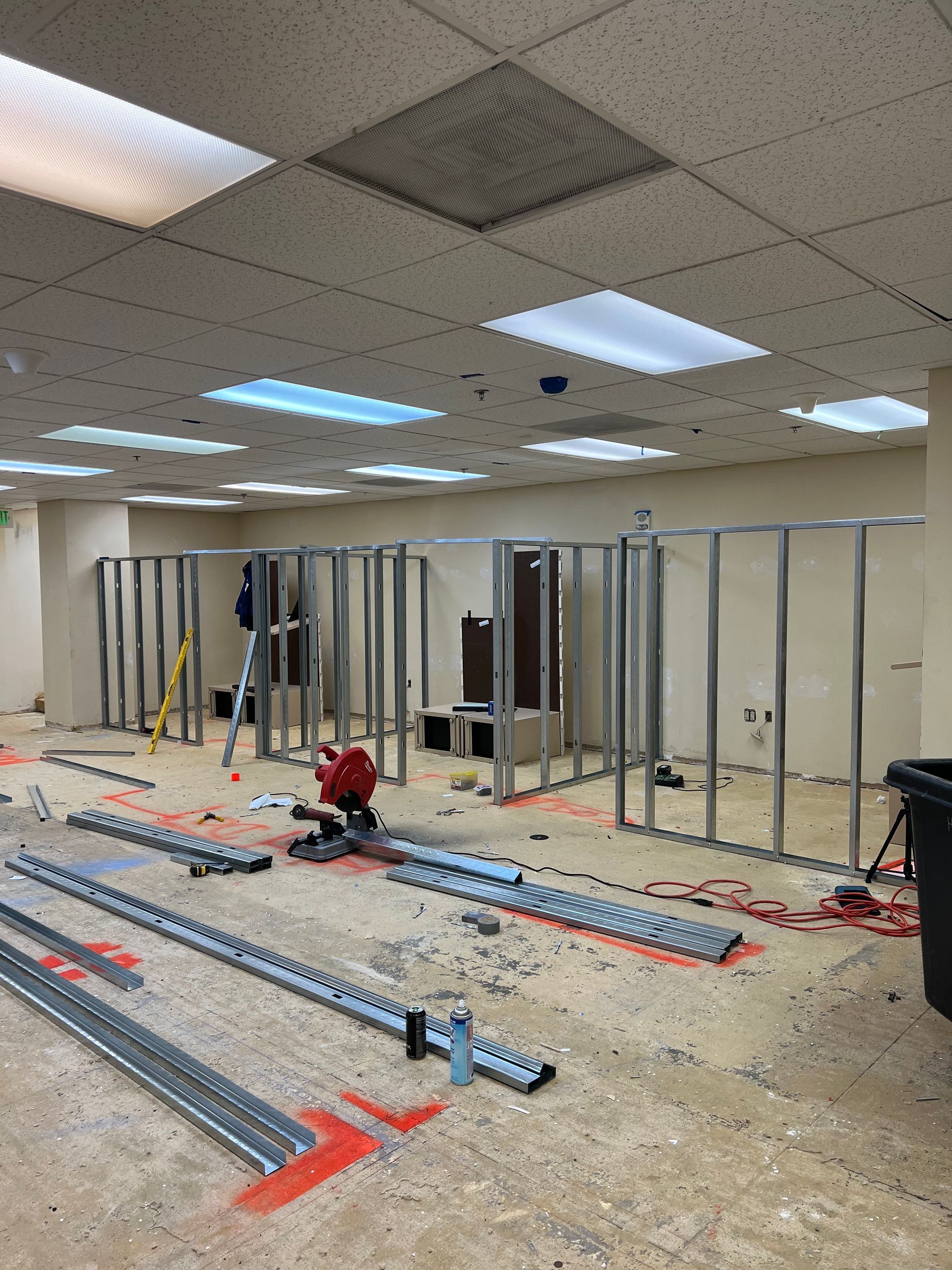 A large room with a lot of metal frames on the floor