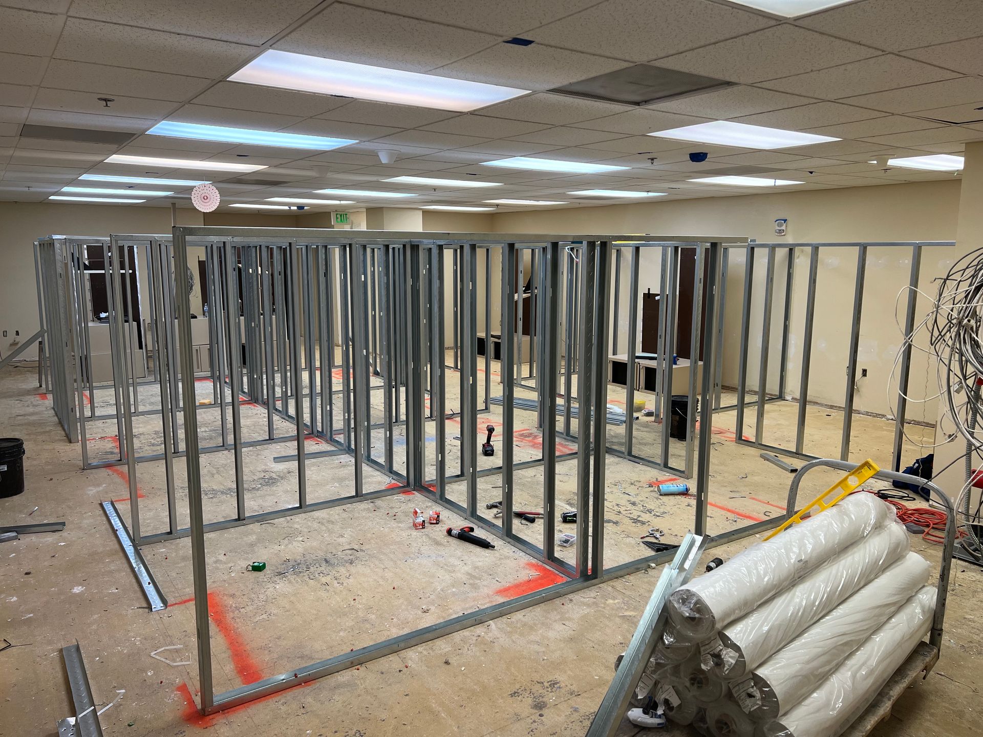 A large room with a lot of metal frames in it.